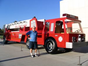 John Varley with toy fire engine by Charles Ray